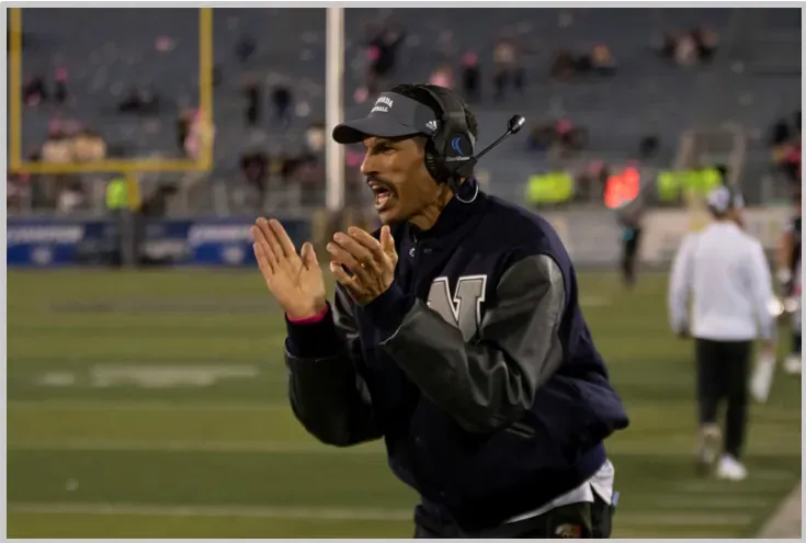 A coach working one-on-one with a salesperson