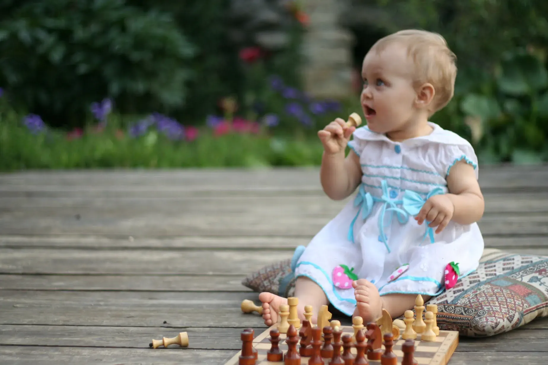 A hand holding a chess piece